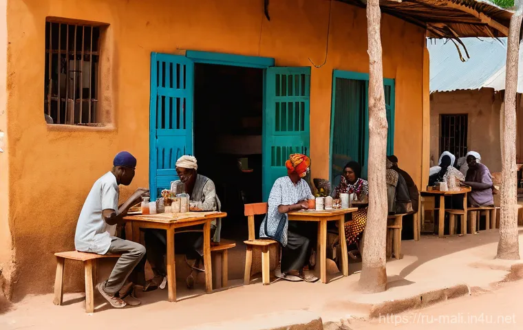 말리에서의 생활비와 물가 - A vibrant, sunlit outdoor market in Bamako, Mali. Numerous local vendors, both men and women, are dr...